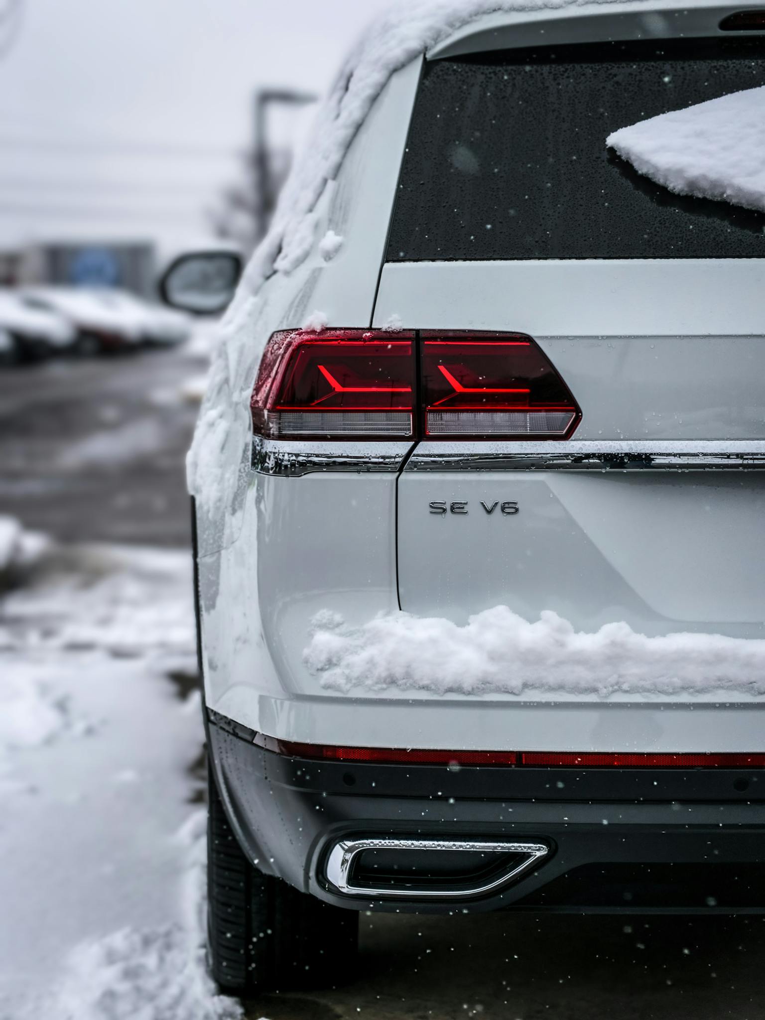 White Car on Snow Covered Road